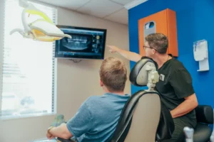 Doctor explaining an x-ray in the TV to a patient