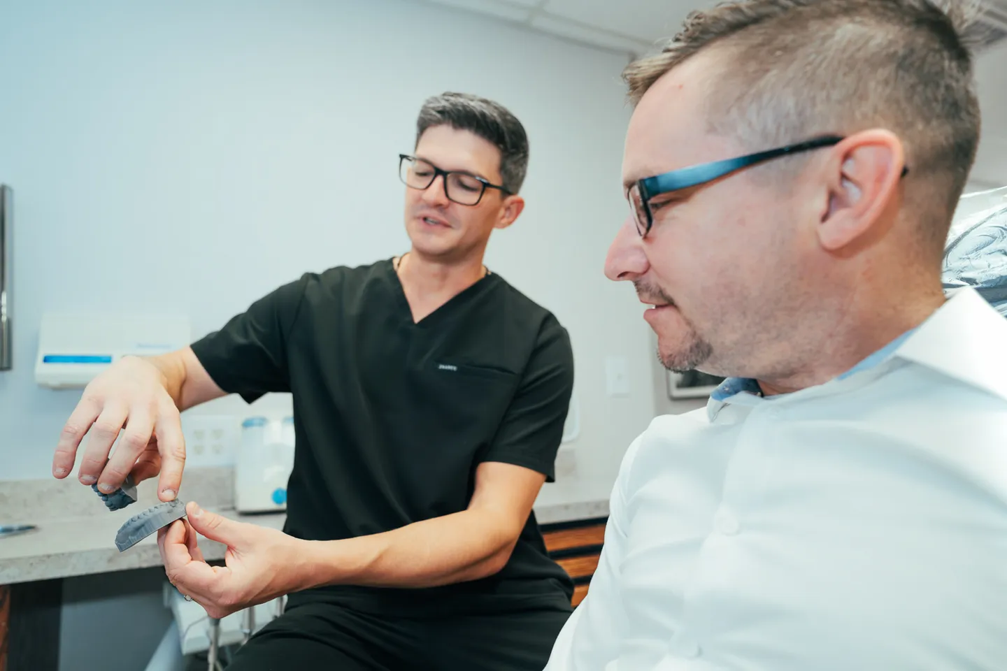 Doctor from Eagle Dental explaining procedure to a patient